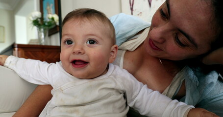 Casual moment of baby and mother together in living-room