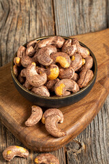Shelled cashew on wooden background. Close-up of fresh cashews