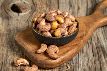 Shelled cashew on wooden background. Close-up of fresh cashews