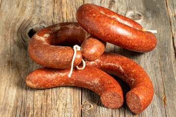 Sausage on a wooden background. Close-up spicy Turkish sausage
