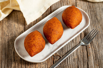 Kibbeh on a wooden background. Traditional Turkish cuisine delicacies. Close-up. local name icli kofte
