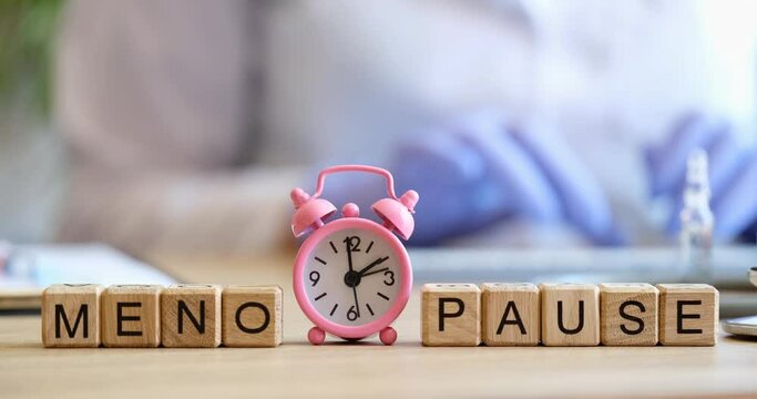 Menopause letters inscription and gynecologist consultation in clinic