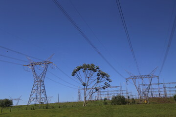 Electricity tower conducting energy produced in Itaipu. Tall metal towers in the middle of the...