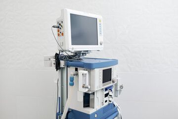 Anesthetic machine with blank screens in medical office