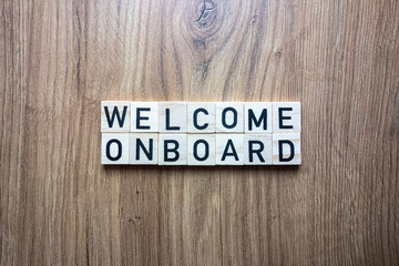 Welcome onboard text from wooden blocks