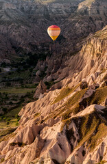hot air balloon over a canyon above Cappadocia