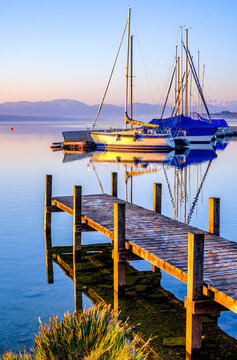 old jetty and sailboats in tutzing - bavaria
