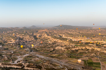 view over Göreme in Cappadocia with some hot air balloons