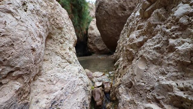 Water flows between the rocks in Nahal David - Ein Gedi Nature Reserve - Israel