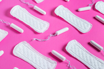 Tampons, feminine sanitary pads pattern on pink background. Hygiene care during critical days....
