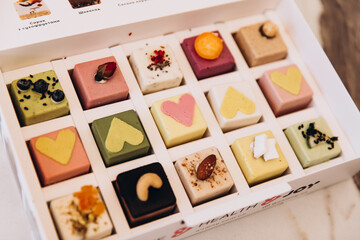 Food. Dessert. Sweets and cakes with different fillings lie in a beautiful box