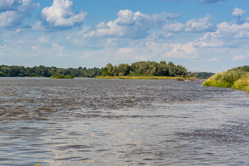 Brown water of poland river Vistula in Summer