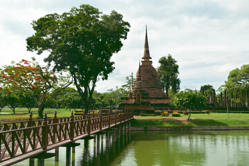 The wood bridge way to Main laterite Pagoda at the Historical Park in Sukhothai.