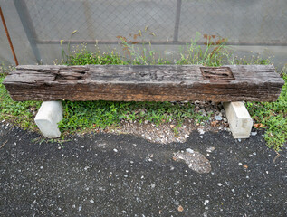 The old wooden bench which is made from the old sleeper tie.