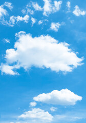 Fototapeta na wymiar blue sky with puffy clouds background