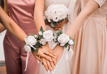 happy bridesmaids holding hands together