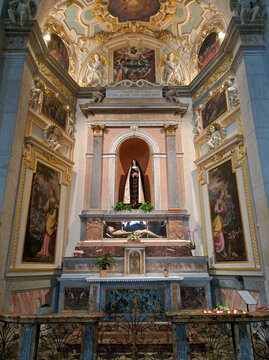 Bellinzona, Switzerland - August 23, 2019: The Interior Of The Collegiate Church Of Saints Peter And Stephen In Bellinzona Is Made In The Baroque Style Using Marble. View Of The Altar With Icons