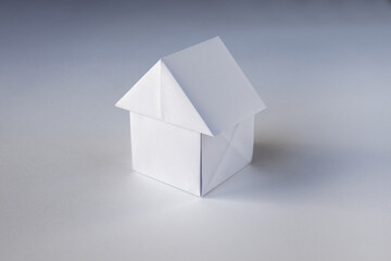 Paper house origami isolated on a white background