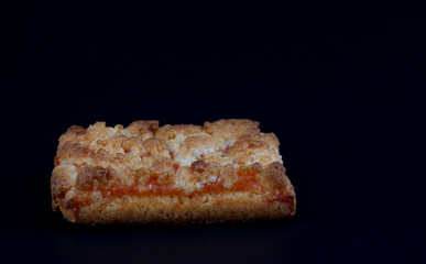 Orange Cookies. Cookies with delicious orange filling on a dark background. close up