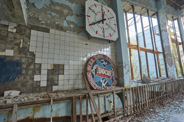 Abandoned swimming pool in Pripyat. Destroyed gym in a radioactive city. The street is overgrown...