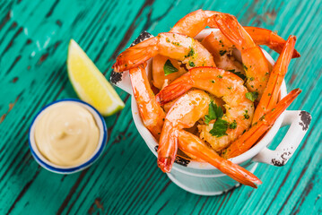 Shrimps cooked, red shrimps cocktail on wooden background with dip.	