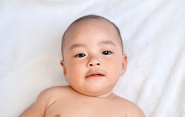 Asian Baby in bed room