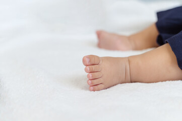 Asian Baby childhood infant sleeping on bed