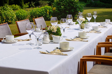 a set table outside in nature. Hotel Restaurant.
