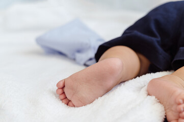 Asian Baby childhood infant sleeping on bed