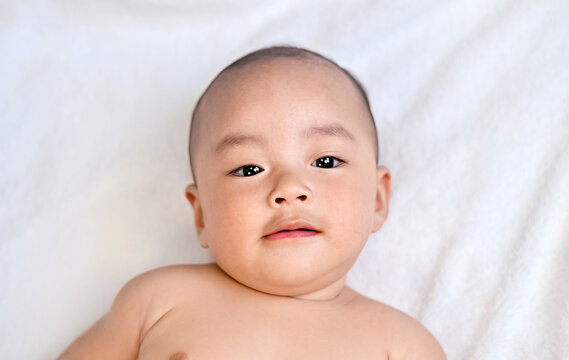 Asian Baby in bed room