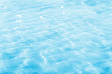 beautiful abstract water background with soft surface and bright sun reflections, empty shiny water...