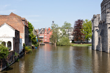 View of Ghent historic center, castle Gravensteen, Leie river  on a sunny day.
