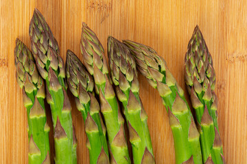 Vegetarian fresh green asparagus. vegetable on wood