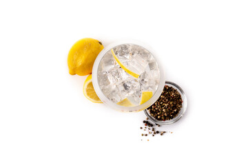 Gin tonic cocktail drink into a glass isolated on white background. Top view