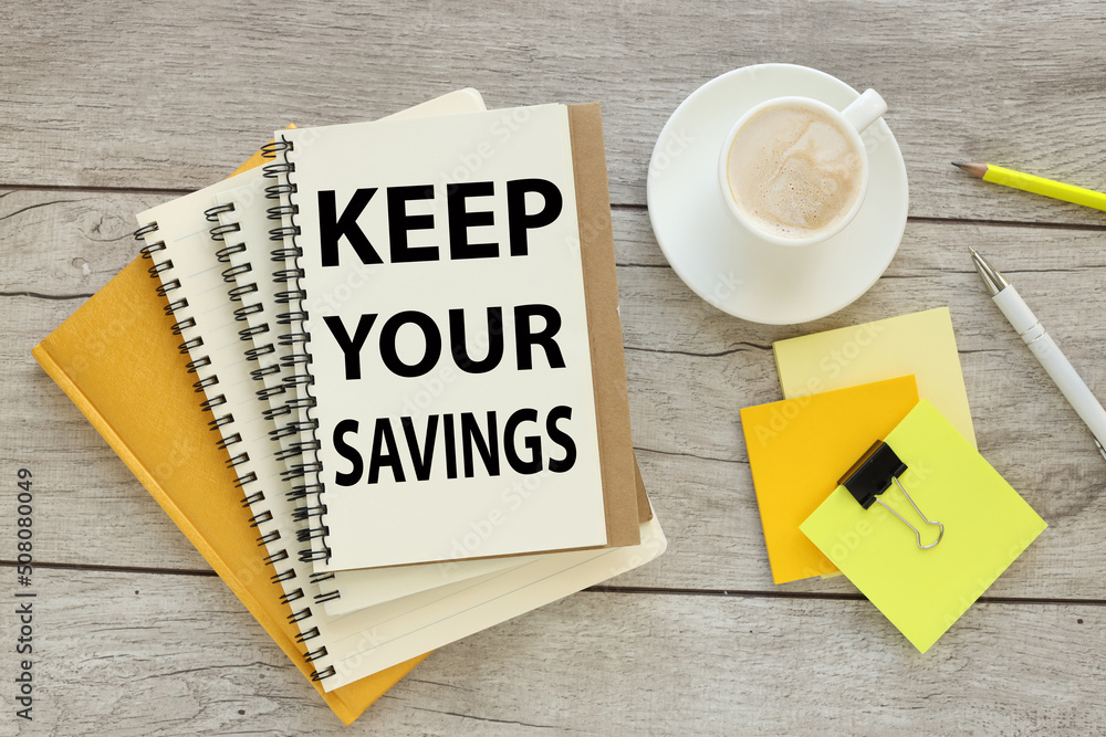 Poster keep your savings. lot of notepads on the desktop. blank sheet of notepad with text. light table sti