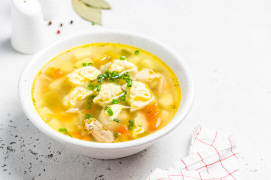 Chicken vegetable soup with dumplings. Copy space.