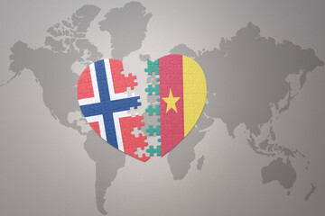 Fototapeta premium puzzle heart with the national flag of norway and cameroon on a world map background. Concept.