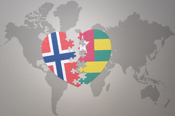 puzzle heart with the national flag of norway and togo on a world map background. Concept.