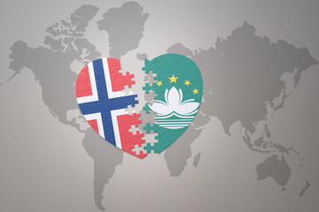 puzzle heart with the national flag of norway and Macau on a world map background. Concept.