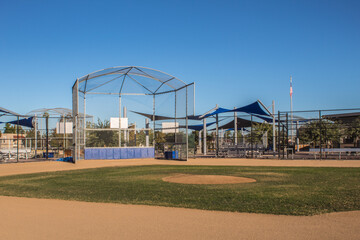 Fototapeta na wymiar Baseball field under clear blue sky.