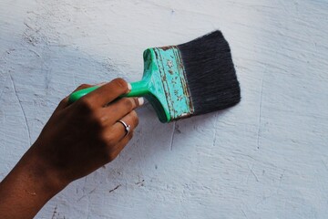 hand with paint brush
