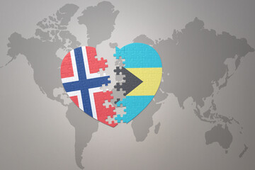 puzzle heart with the national flag of norway and bahamas on a world map background. Concept.