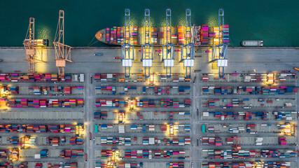 Aerial view container ship working at night terminal dock seaport, Global business company import...