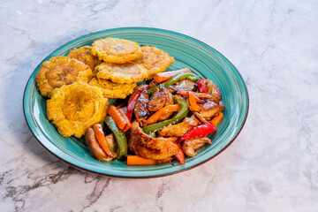 Chopped steak or Bistec Picao and patacones or tostones are fried green plantain slices, made with green plantains, Typical latin food, Panamá, Central America
