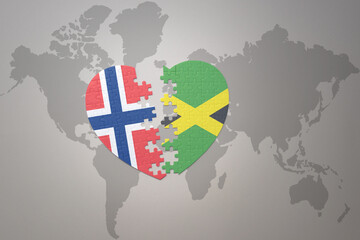 Naklejka premium puzzle heart with the national flag of norway and jamaica on a world map background. Concept.