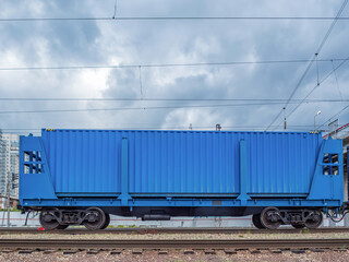 Fototapeta na wymiar Flatcar with sidebeams with 40ft container on Trans-Siberian Railroad.