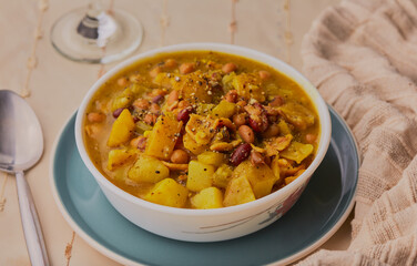 Spicy bacon and potato stew with herbs and spices.