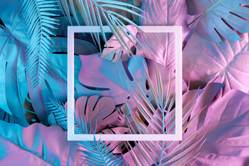 Jungle neon color layout with leaves in vibrant gradient holographic colors and frame. Flat lay....