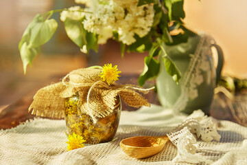 Homemade herbal organic dandelion tincture with wild flowers. Dandelion root tincture...