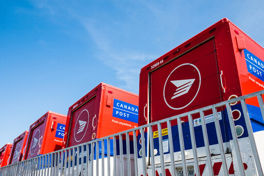 Canada Post Mail Vehicles Parked Outside A Sorting Facility On May 16, 2010 In Toronto, Canada